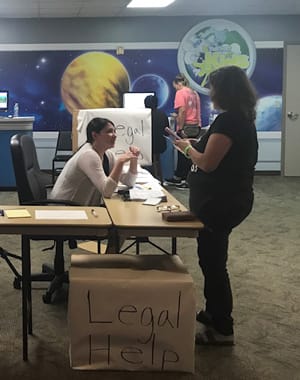 Staff from Pipkin Ferguson PLLC at community legal help desk following Hurricane Harvey